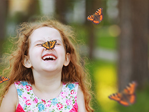 Girl with a butterfly on her nose 